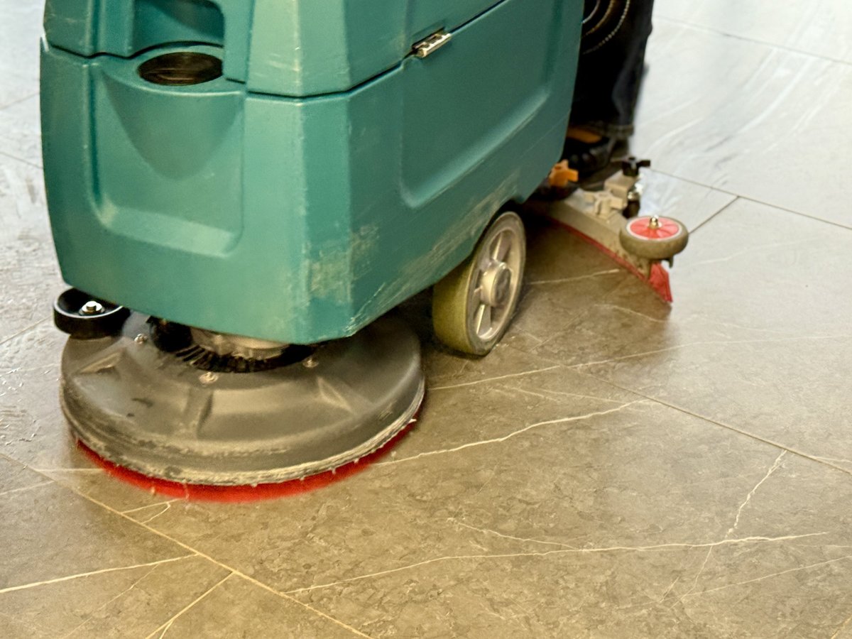 Industrial Floor Scrubber Cleaning Shiny Tiles Inside Corporate Lobby